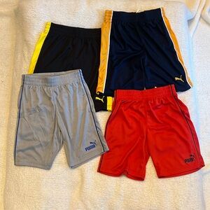 Four Puma shorts for boys size 6
